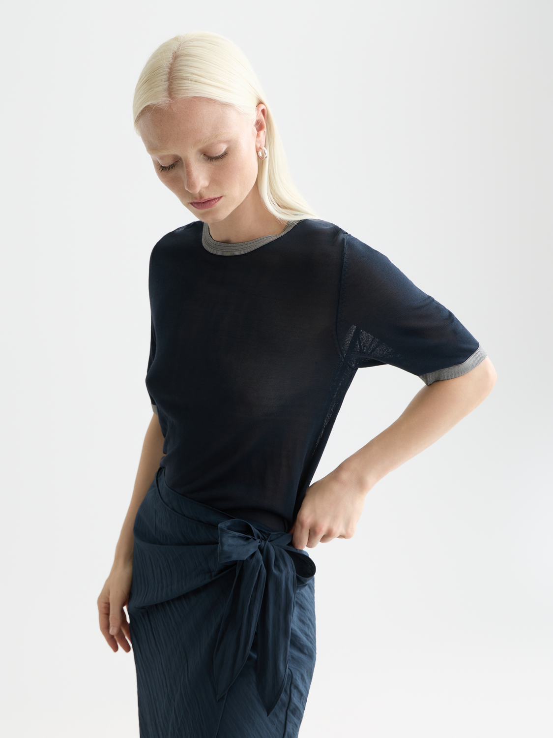 Light blue short-sleeved knitwear pullover by Scotch & Soda, featuring a classic crew neck and soft fabric texture.