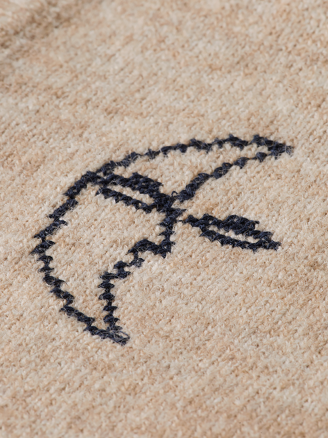 Black knitted tank top by Scotch & Soda, featuring a ribbed knit texture and sleeveless design.