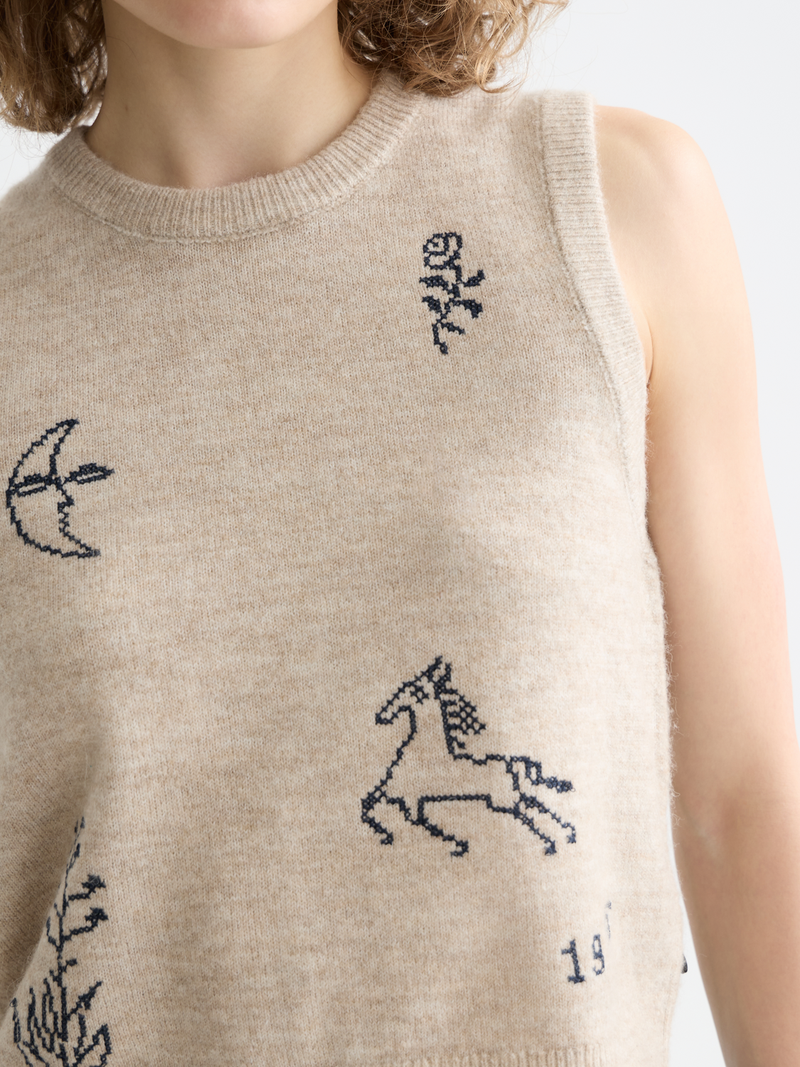 Blue knitted tank top from SCOTCH & SODA, featuring ribbed knit texture and sleeveless design.