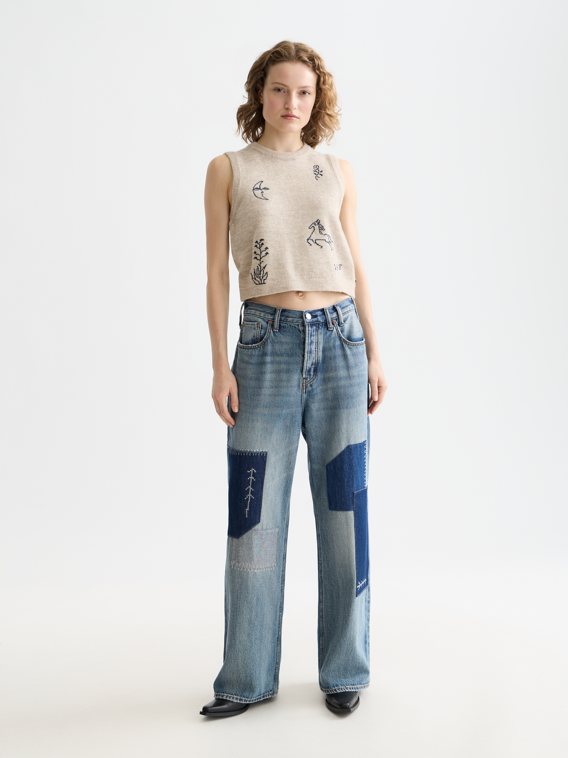 Gray knitted tank top from Scotch & Soda featuring a ribbed texture and sleeveless design.