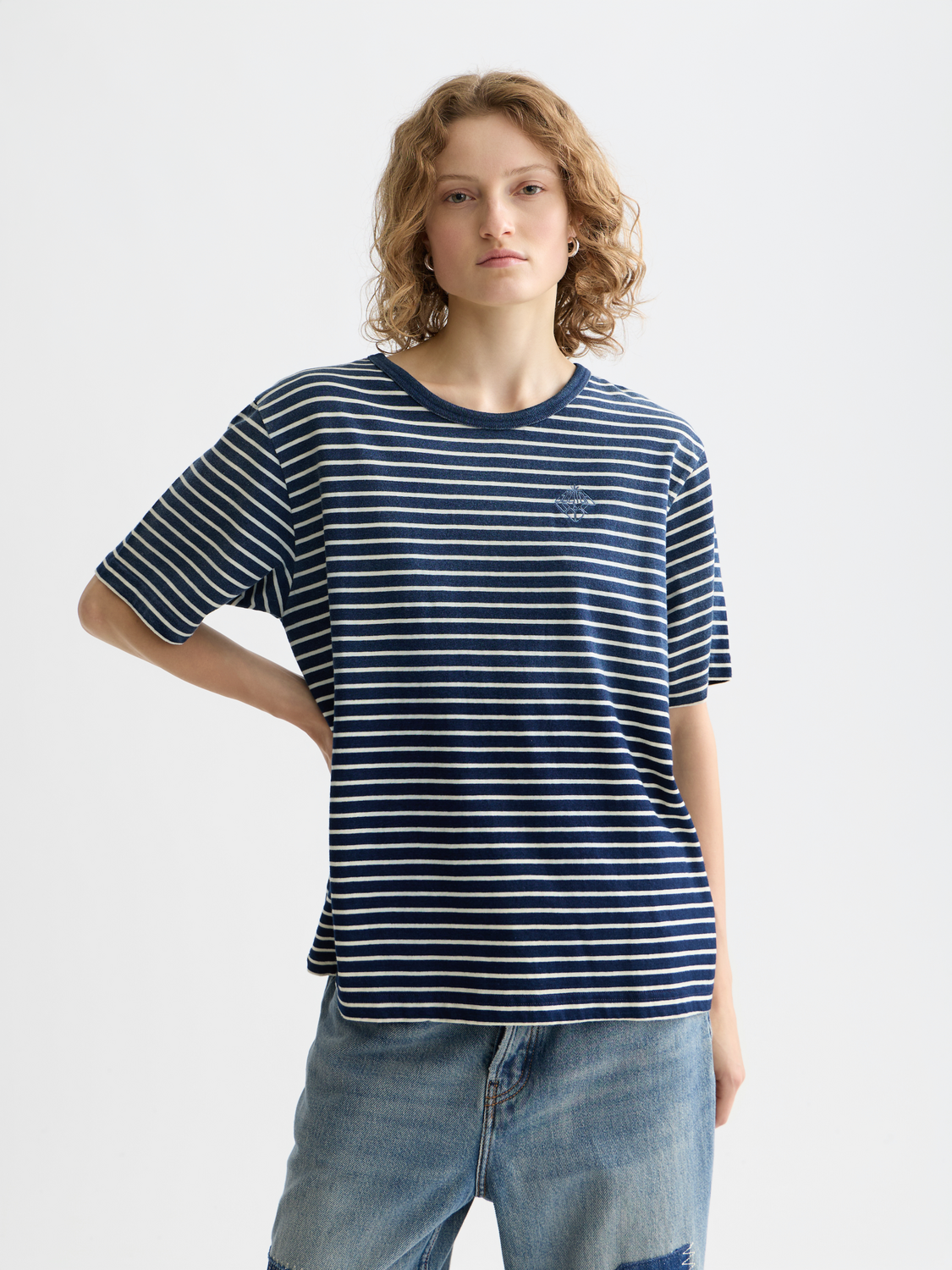 Indigo washed Scotch & Soda short-sleeve t-shirt with a relaxed fit and casual style, displayed on a hanger.