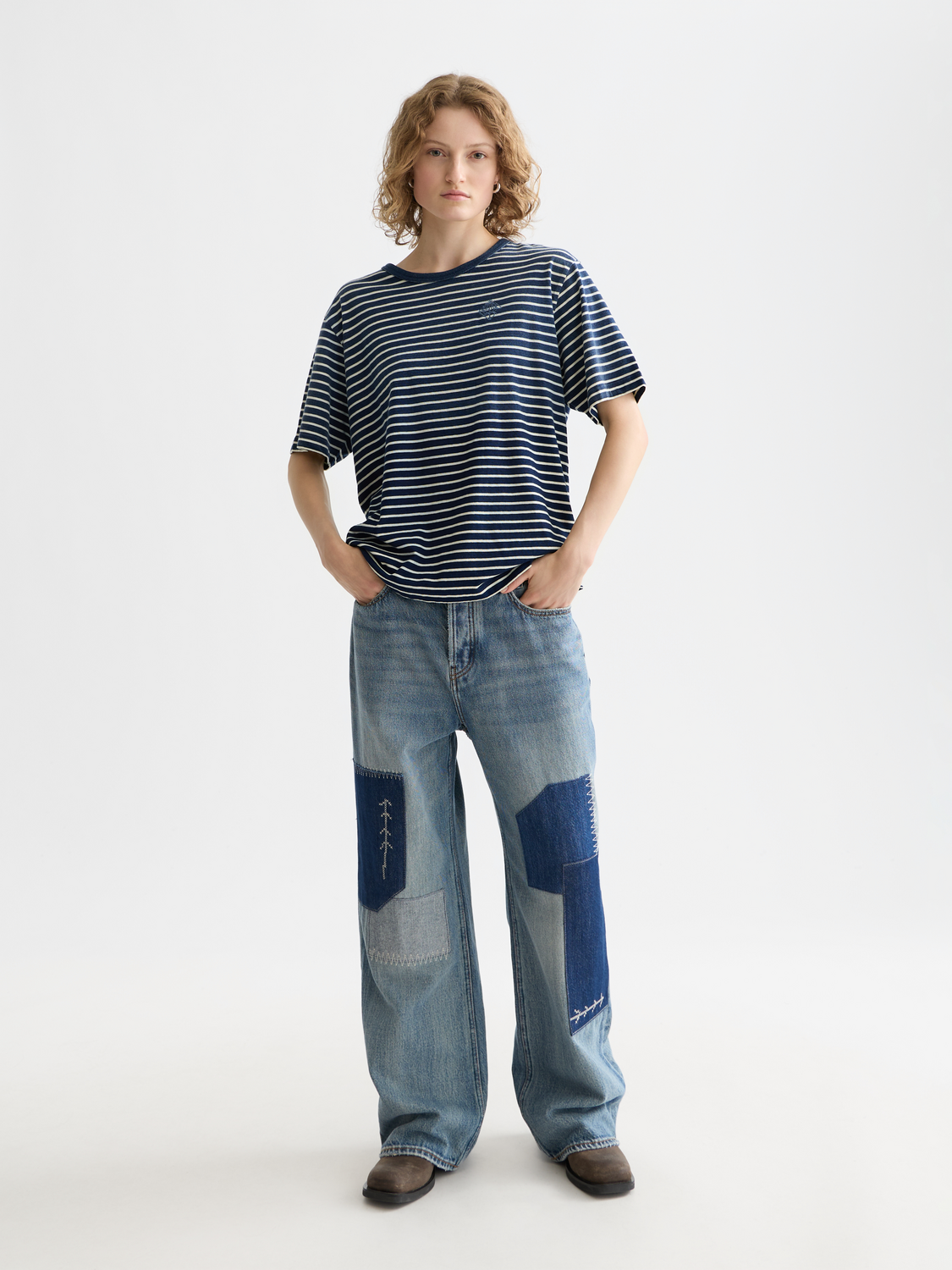 Indigo washed Scotch & Soda short-sleeve t-shirt with a relaxed fit, showcasing a casual, stylish design on the front.