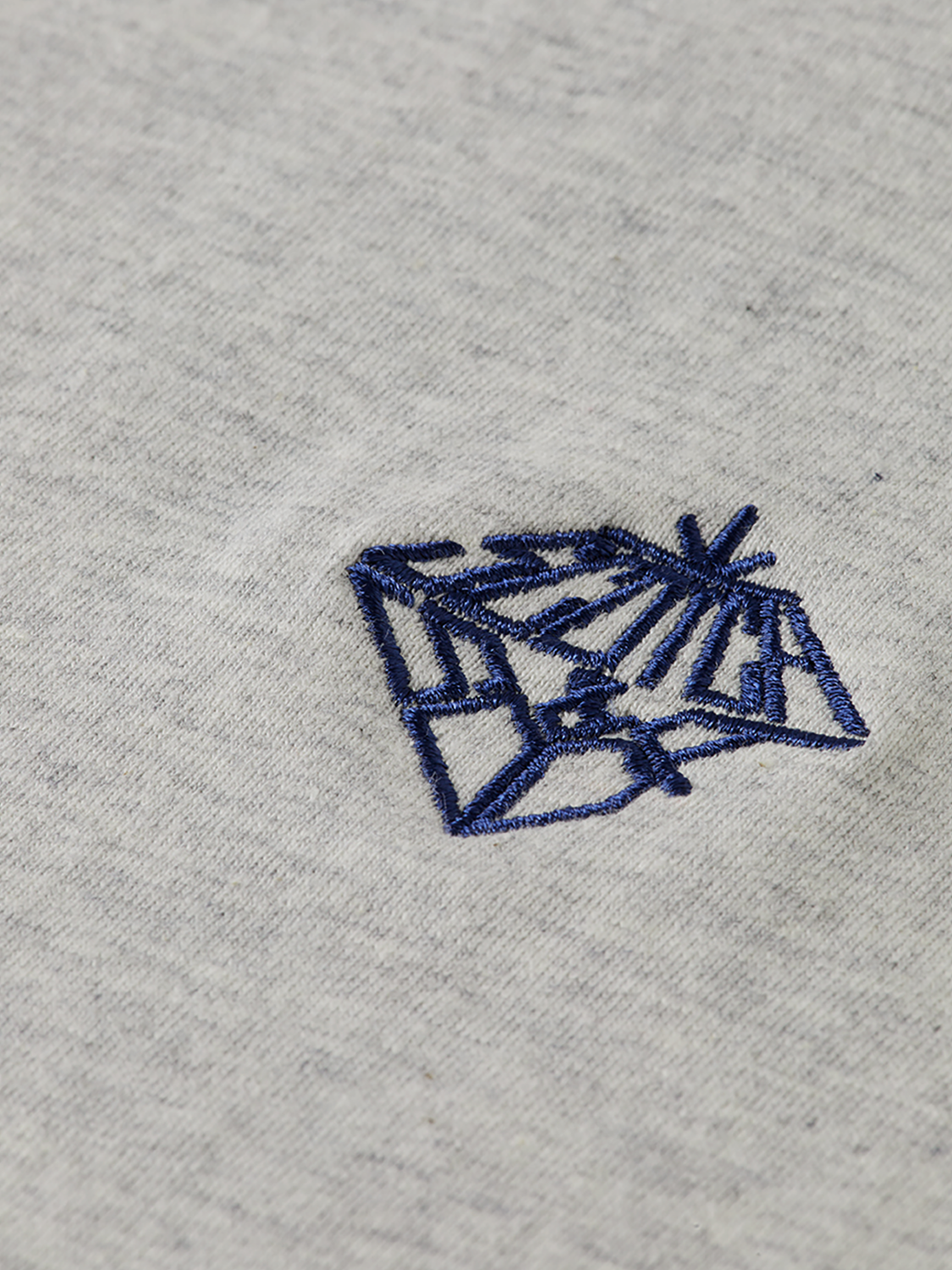 Blue embroidered Scotch & Soda short-sleeve t-shirt with colorful floral embroidery on the front.