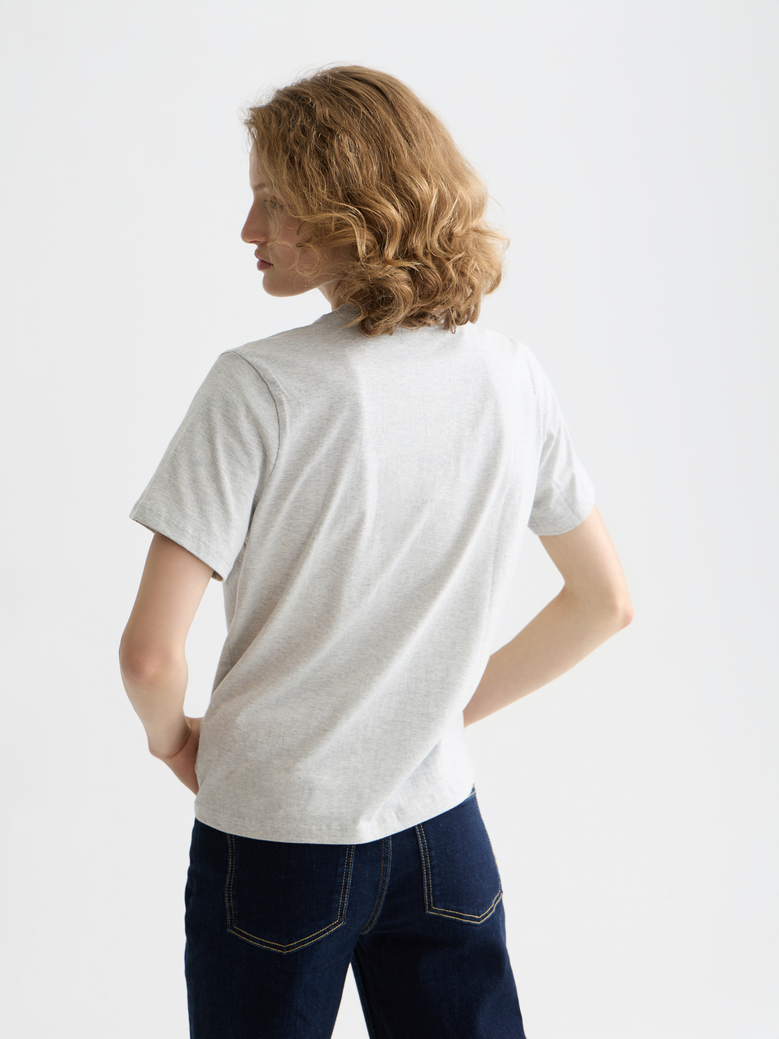 Scarlet embroidered Scotch & Soda short-sleeve t-shirt with colorful floral designs on the back and front.