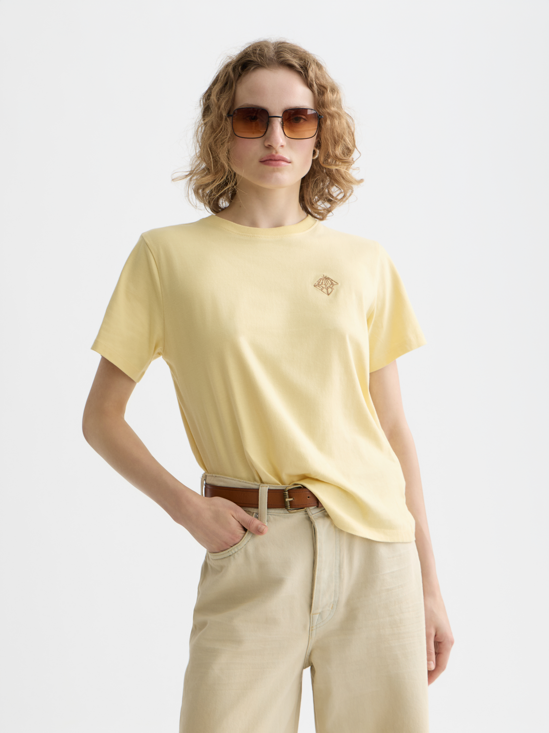 Short-sleeve embroidered t-shirt by Scotch & Soda featuring colorful floral embroidery on soft cotton fabric.