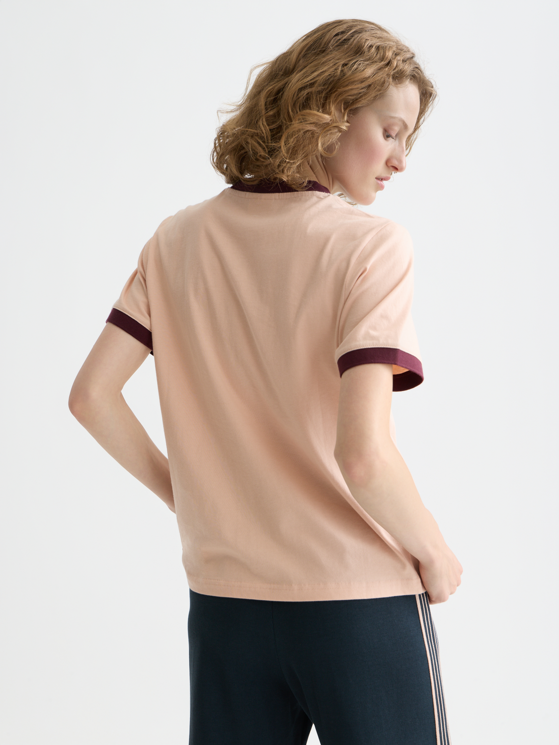 Black embroidered ringer t-shirt from Scotch & Soda with short sleeves and a classic crew neckline, featuring colorful embroidered details.