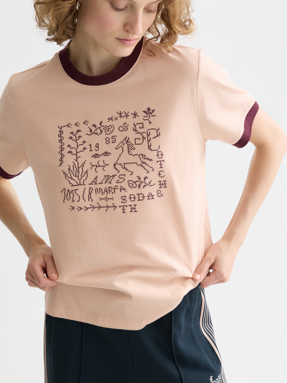 Embroidered SCOTCH & SODA short-sleeve ringer t-shirt with colorful floral embroidery on the chest and white contrasting collar.