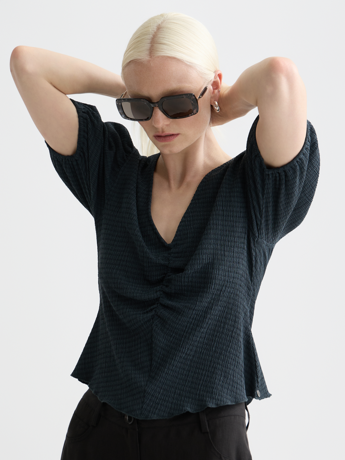 Structured v-neck Scotch & Soda short sleeve tee with a fitted design, shown in a neutral color on a model.