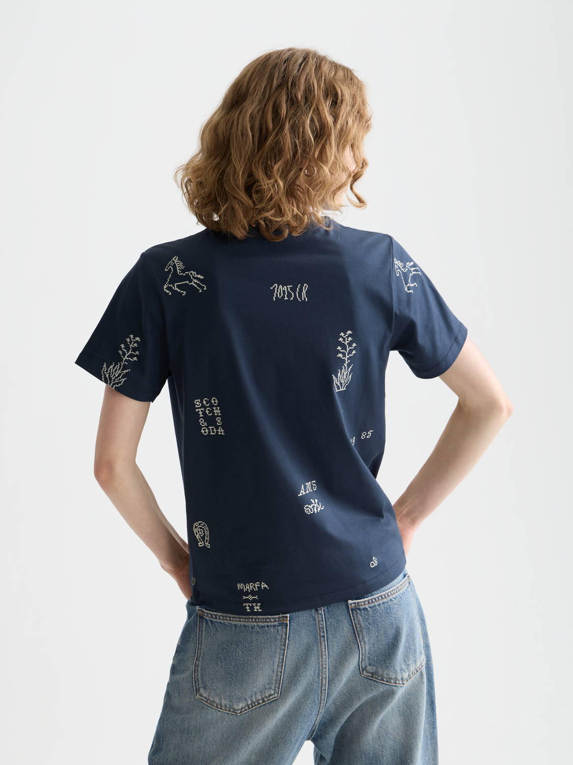 Printed Scotch & Soda short-sleeve t-shirt featuring a colorful graphic design on the back and front.