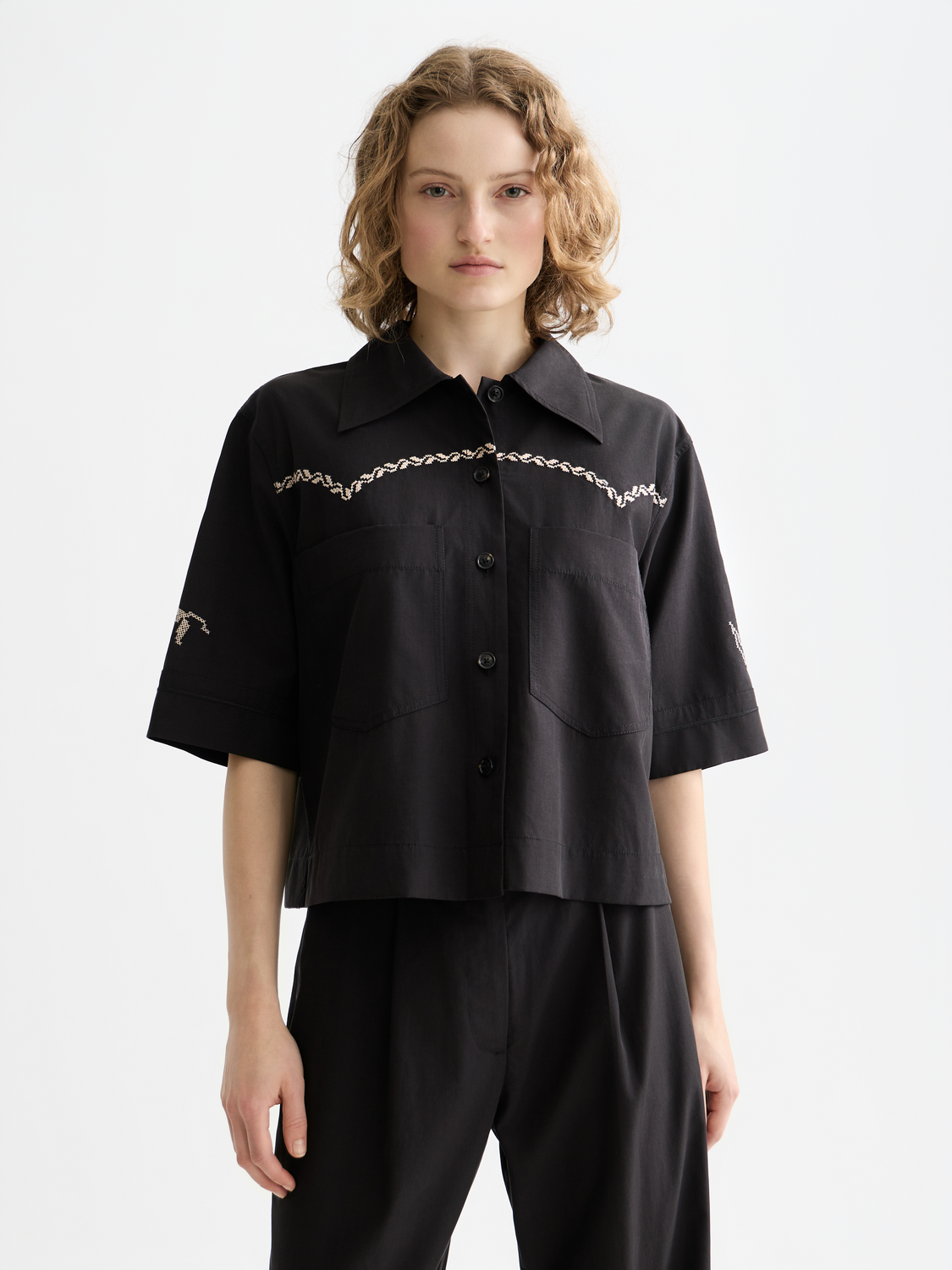 Short-sleeved Scotch & Soda shirt with a classic collar, featuring a patterned design in blue and white.