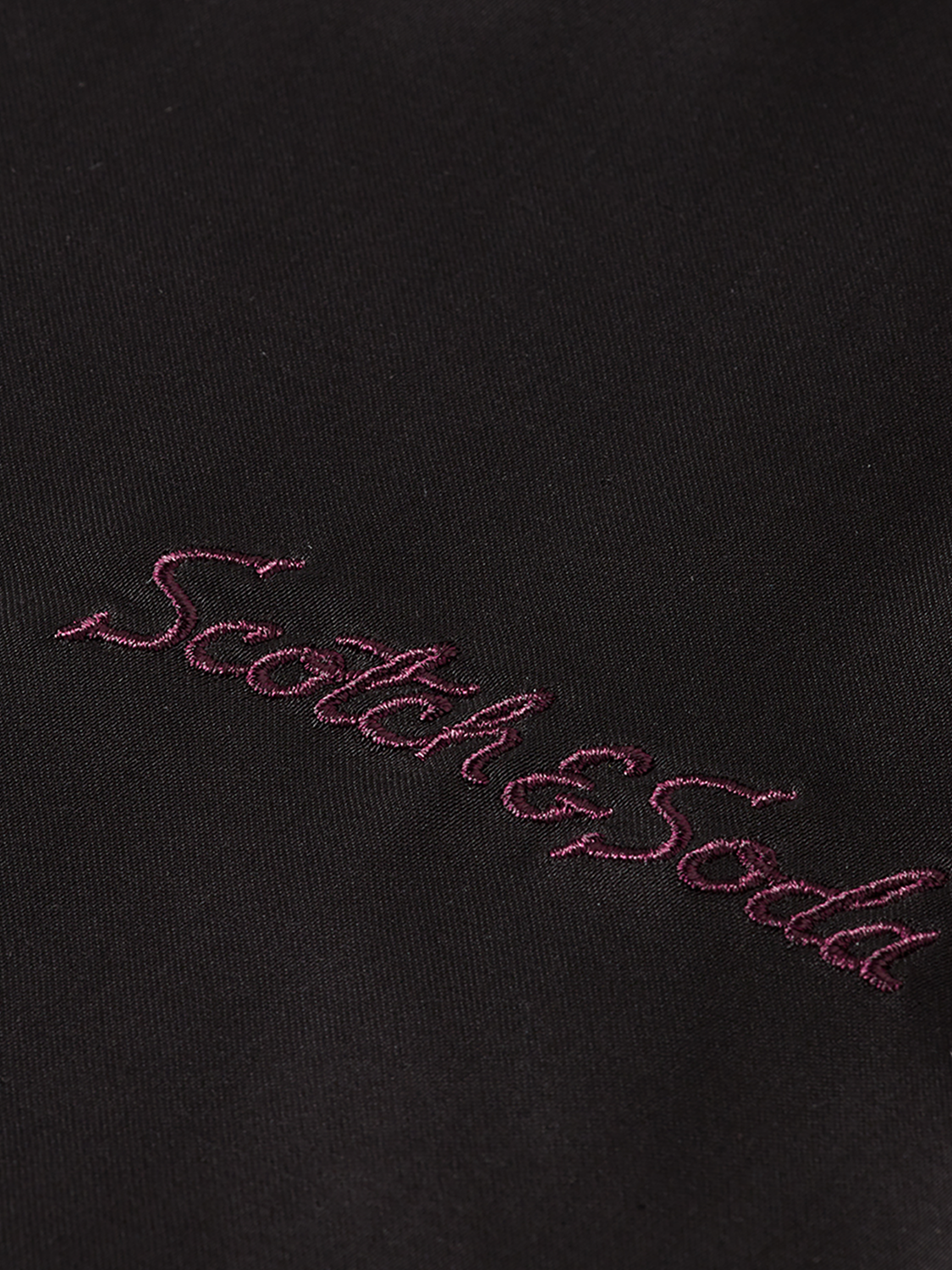 Embroidered Scotch & Soda short sleeve shirt with detailed floral embroidery on light fabric, casual summer style.