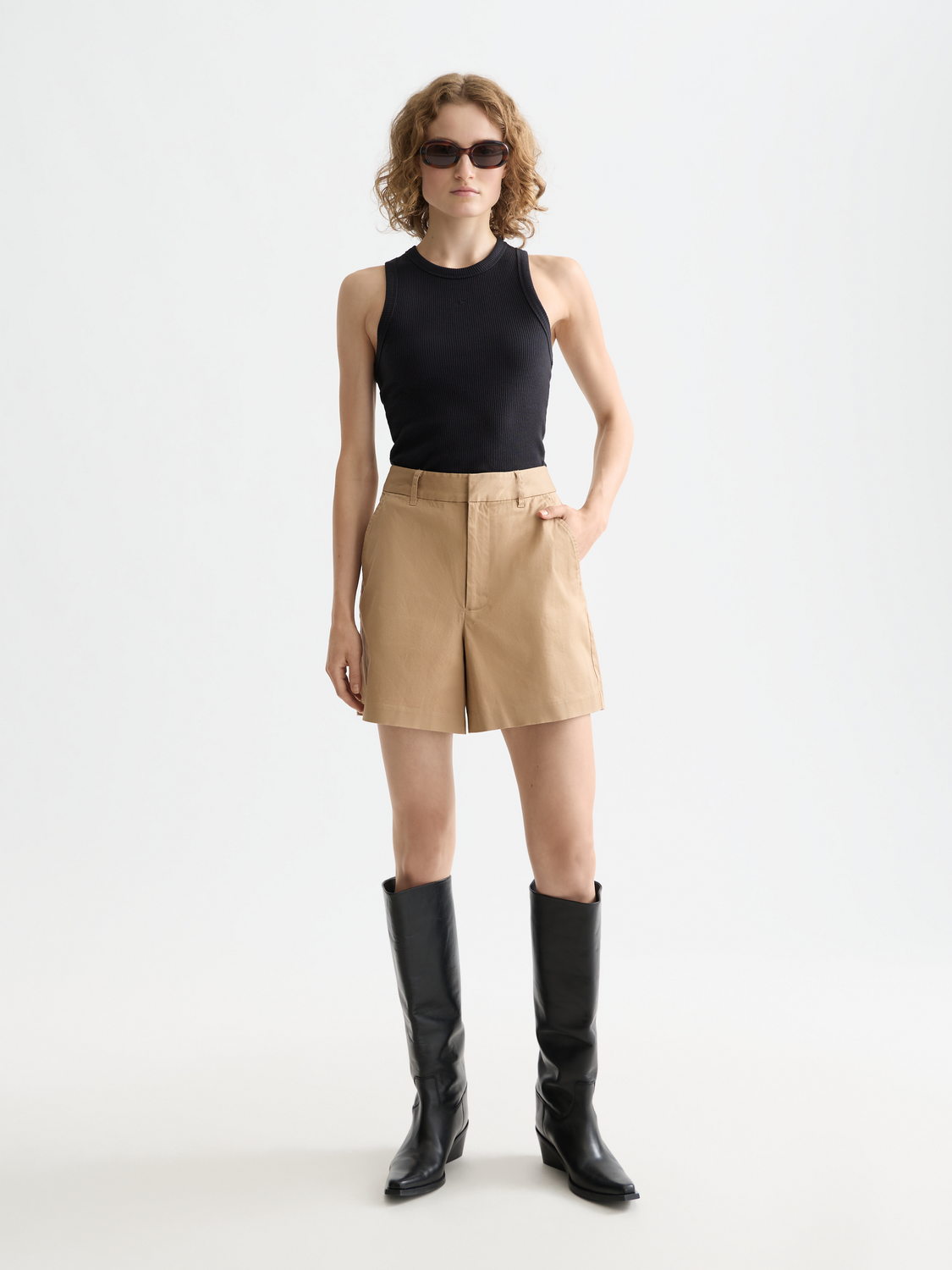 Ribbed racer tank top from Scotch & Soda, showing a close-up of the fitted, textured fabric in a neutral color.