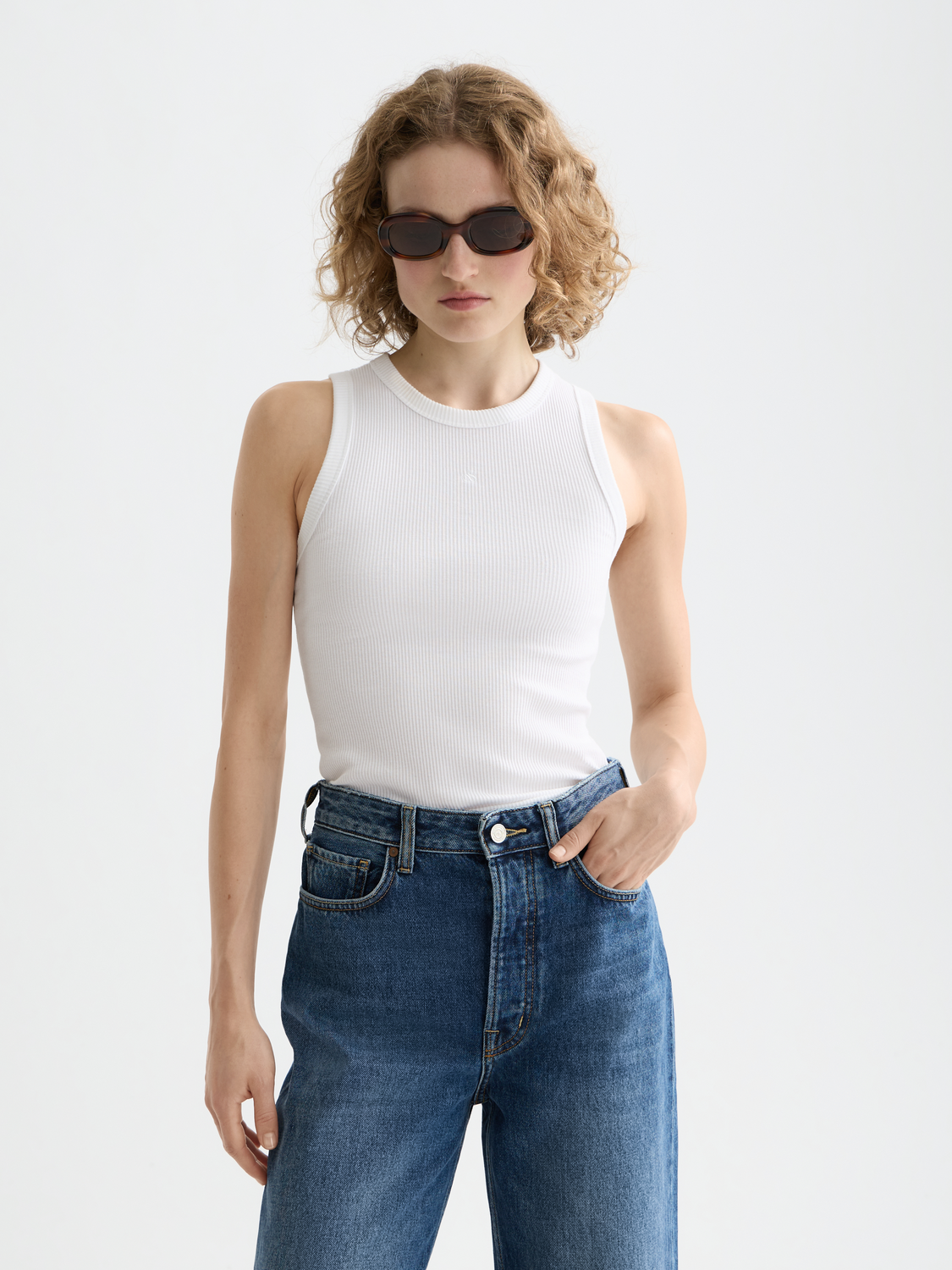Ribbed Scotch & Soda racer tank top in neutral color, close-up view of fitted sleeveless design and ribbed fabric.