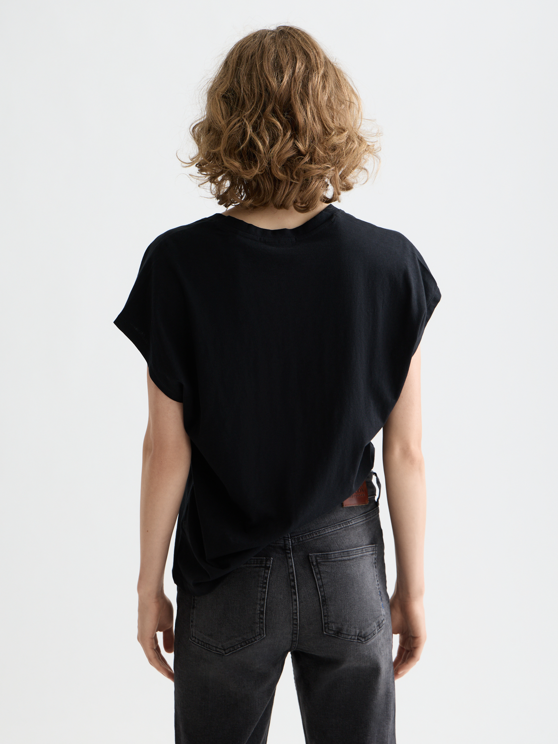 Black Scotch & Soda slub v-neck t-shirt with short sleeves and relaxed fit, shown from the back.