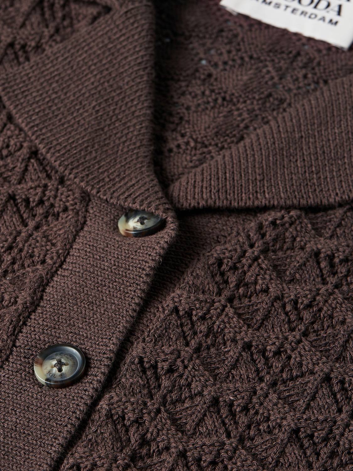 Pointelle short-sleeved knitwear cardigan by Scotch & Soda, featuring delicate openwork pattern and ribbed trim.