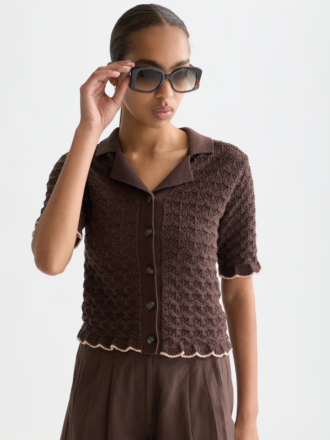 Pointelle short-sleeved cardigan by Scotch & Soda, featuring delicate knitwear with subtle pattern and ribbed edges.
