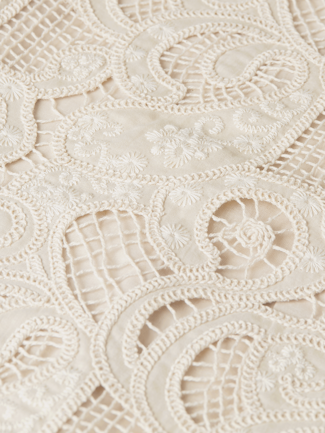 Embroidered woven top by Scotch & Soda featuring intricate embroidery and a stylish fit, displayed on a hanger.