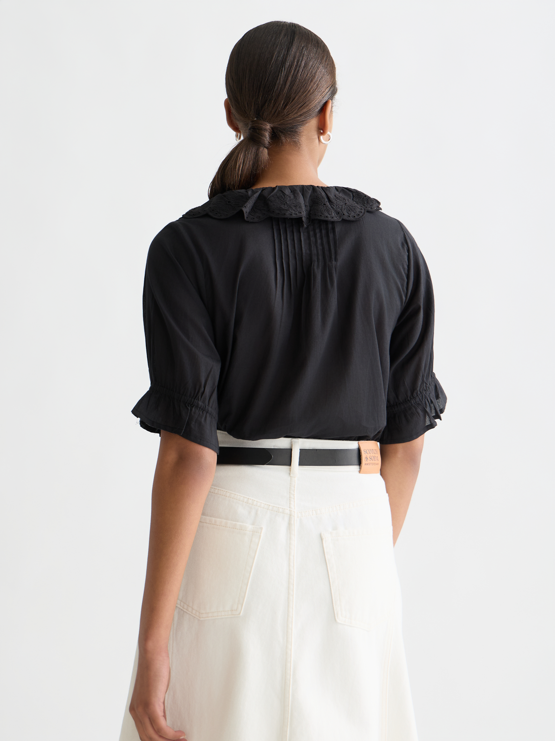 Embroidered short-sleeved woven blouse by Scotch & Soda featuring floral embroidery and a relaxed fit, back view.