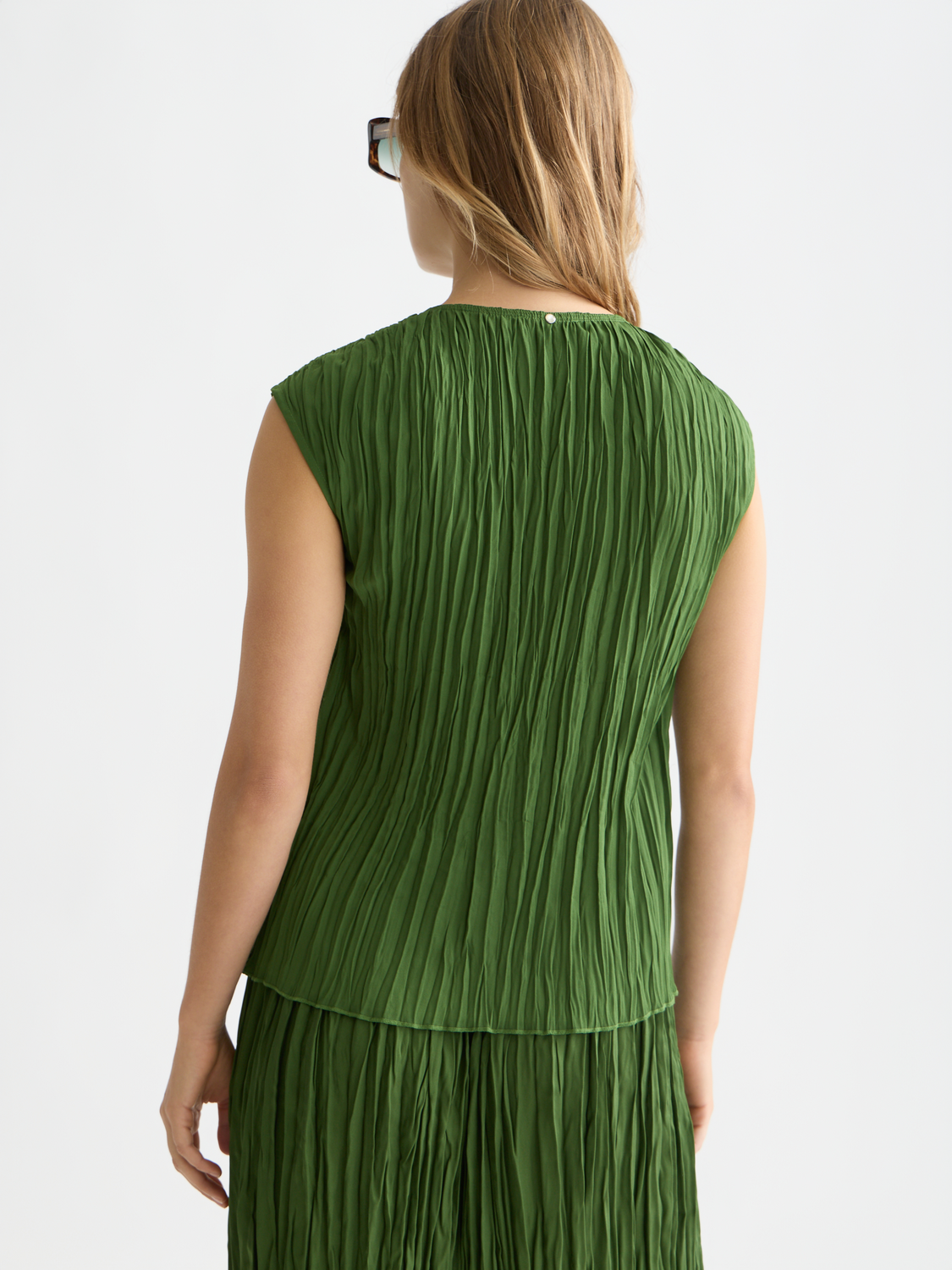 Printed pleat woven top by Scotch & Soda featuring a stylish design with pleats and a relaxed fit, shown from the back.