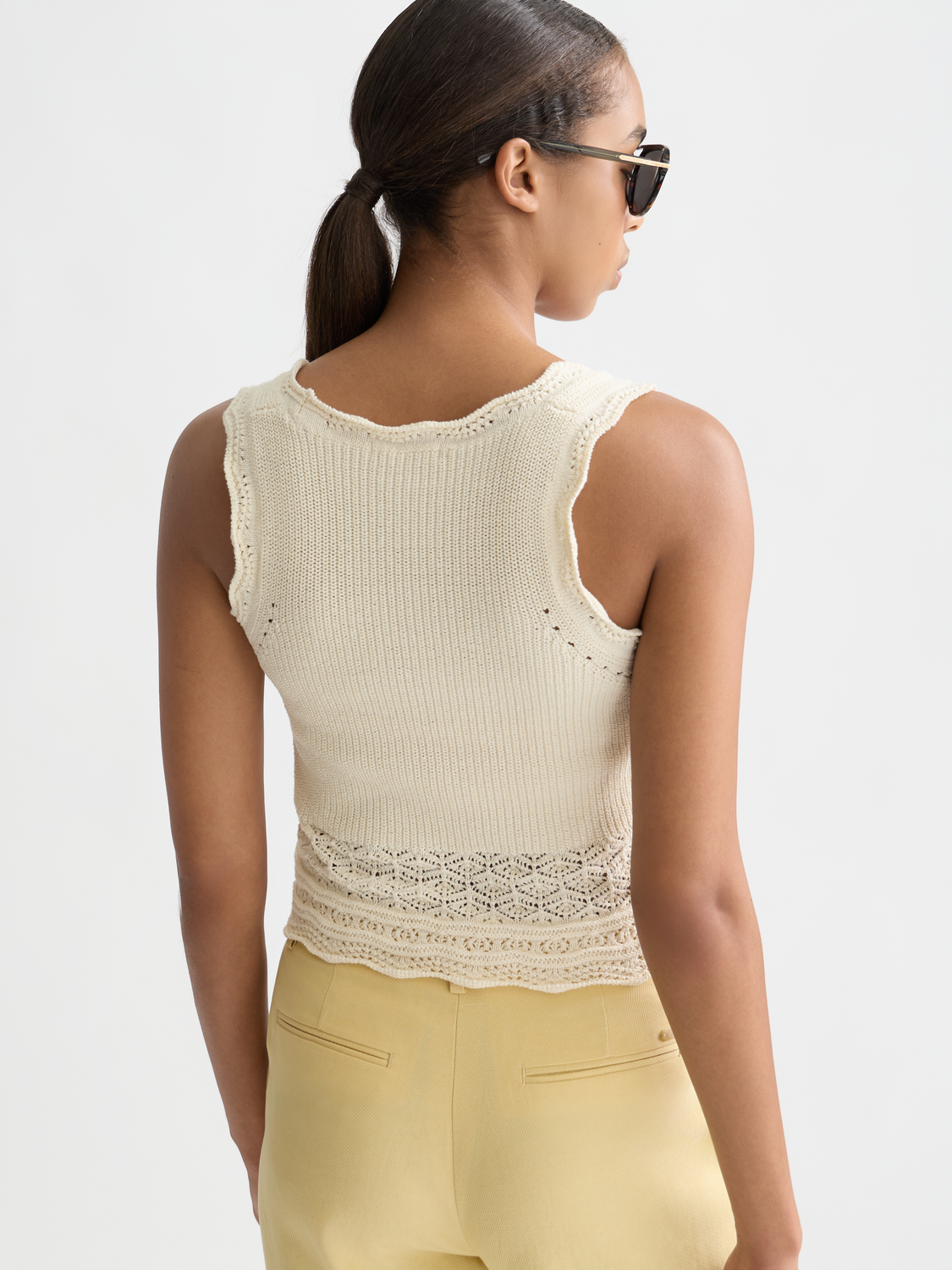 Pointelle knitted vest tank top by Scotch & Soda, showing back view with delicate open-knit pattern and ribbed edges.
