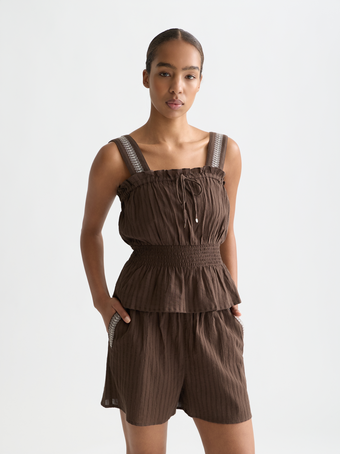 Smocked waist tank top from Scotch & Soda, featuring a fitted design and sleeveless style in a casual, stylish look.