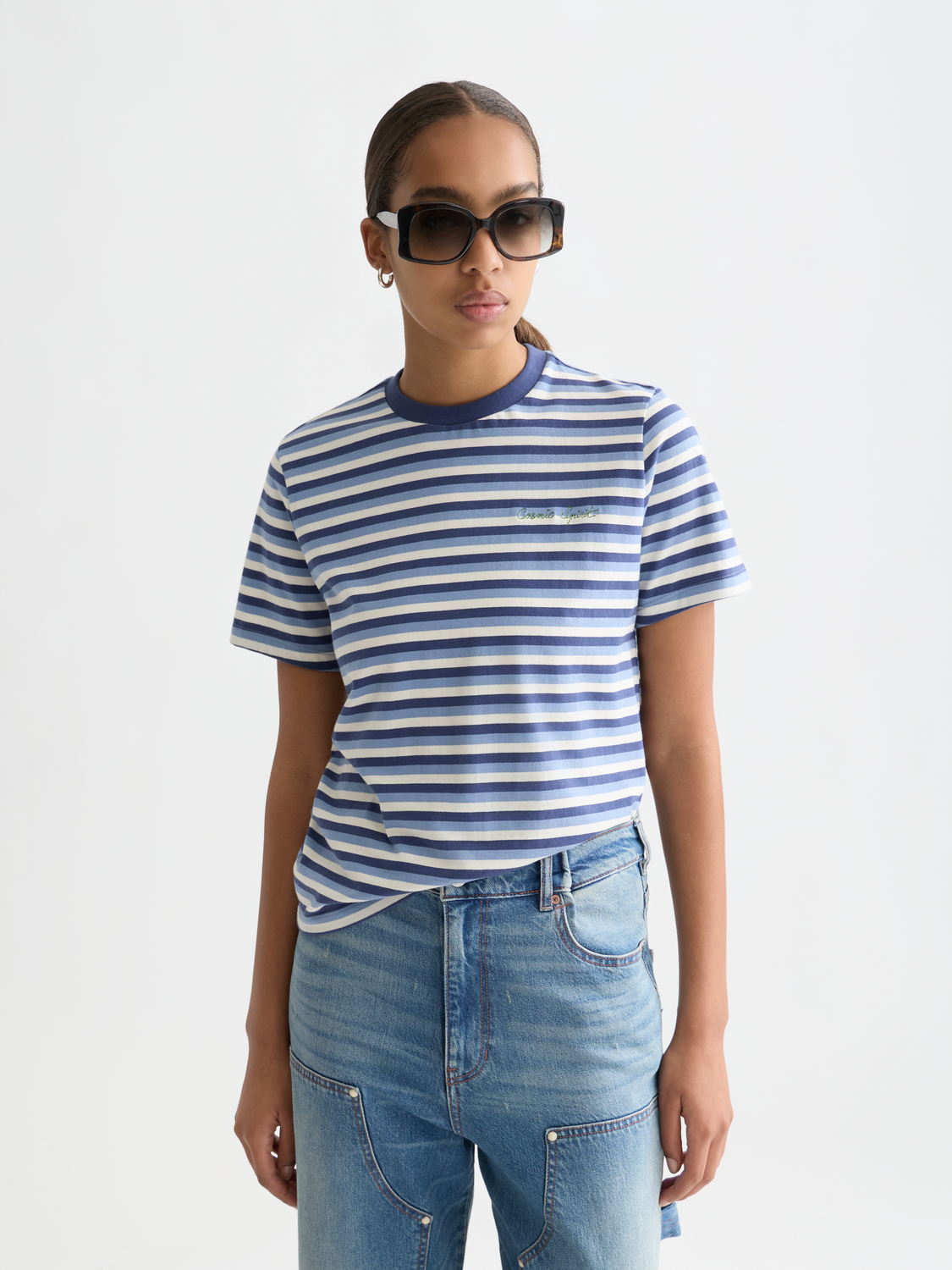 Striped Scotch & Soda short-sleeve t-shirt with blue, white, and red horizontal stripes, front view on a model.