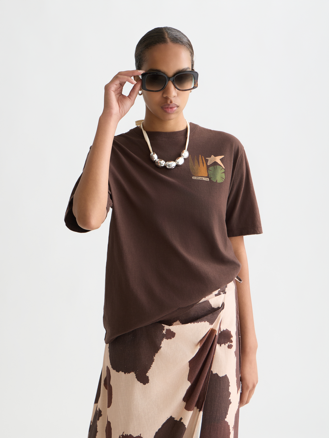 Short-sleeve Scotch & Soda artwork T-shirt with colorful graphic print on front, casual fit, and soft fabric.
