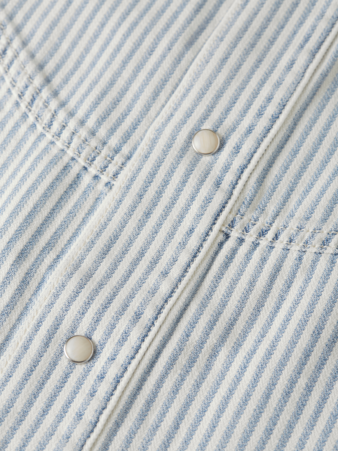 Short-sleeved denim shirt by Scotch & Soda, featuring classic blue denim fabric and casual button-up design.