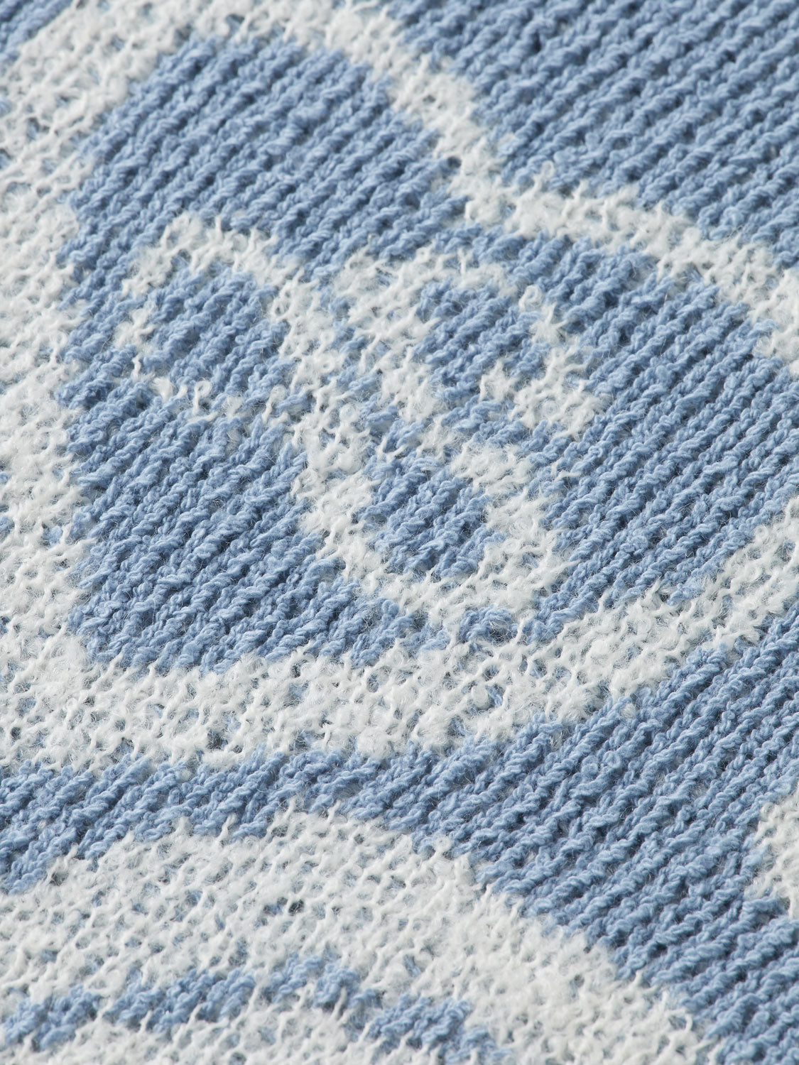 Scotch & Soda jacquard knit pullover featuring intricate pattern and cozy fit, displayed on a neutral background.