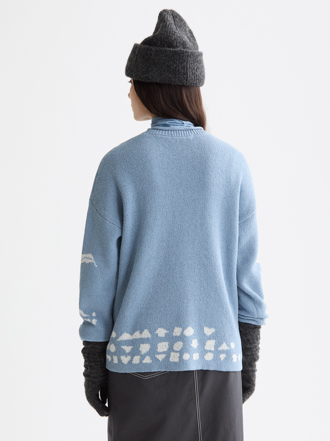 Scotch & Soda jacquard knitwear pullover featuring intricate woven patterns, shown from the back in a stylish, textured fabric.