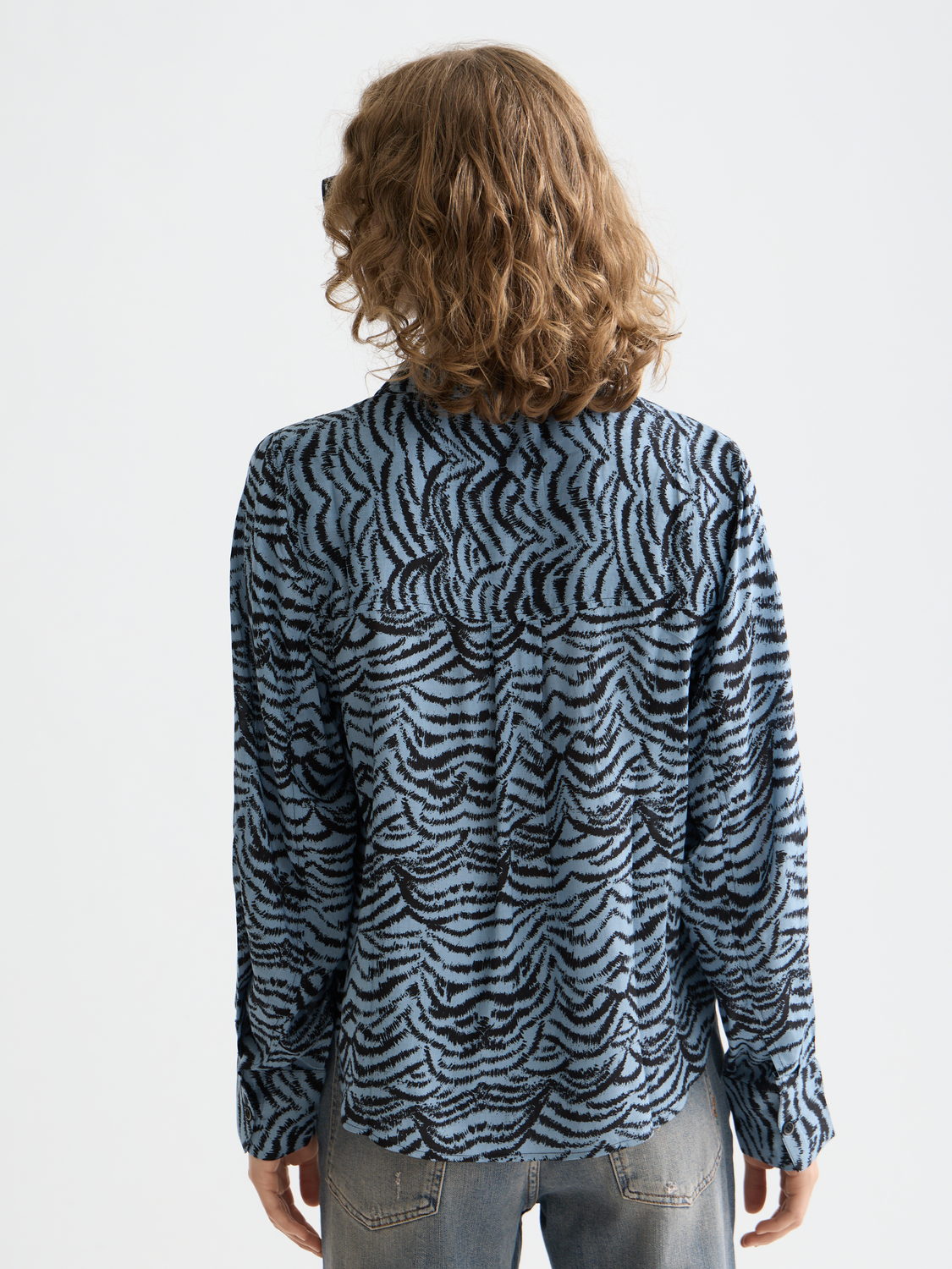Long-sleeve printed shirt by Scotch & Soda featuring colorful patterns on soft fabric.