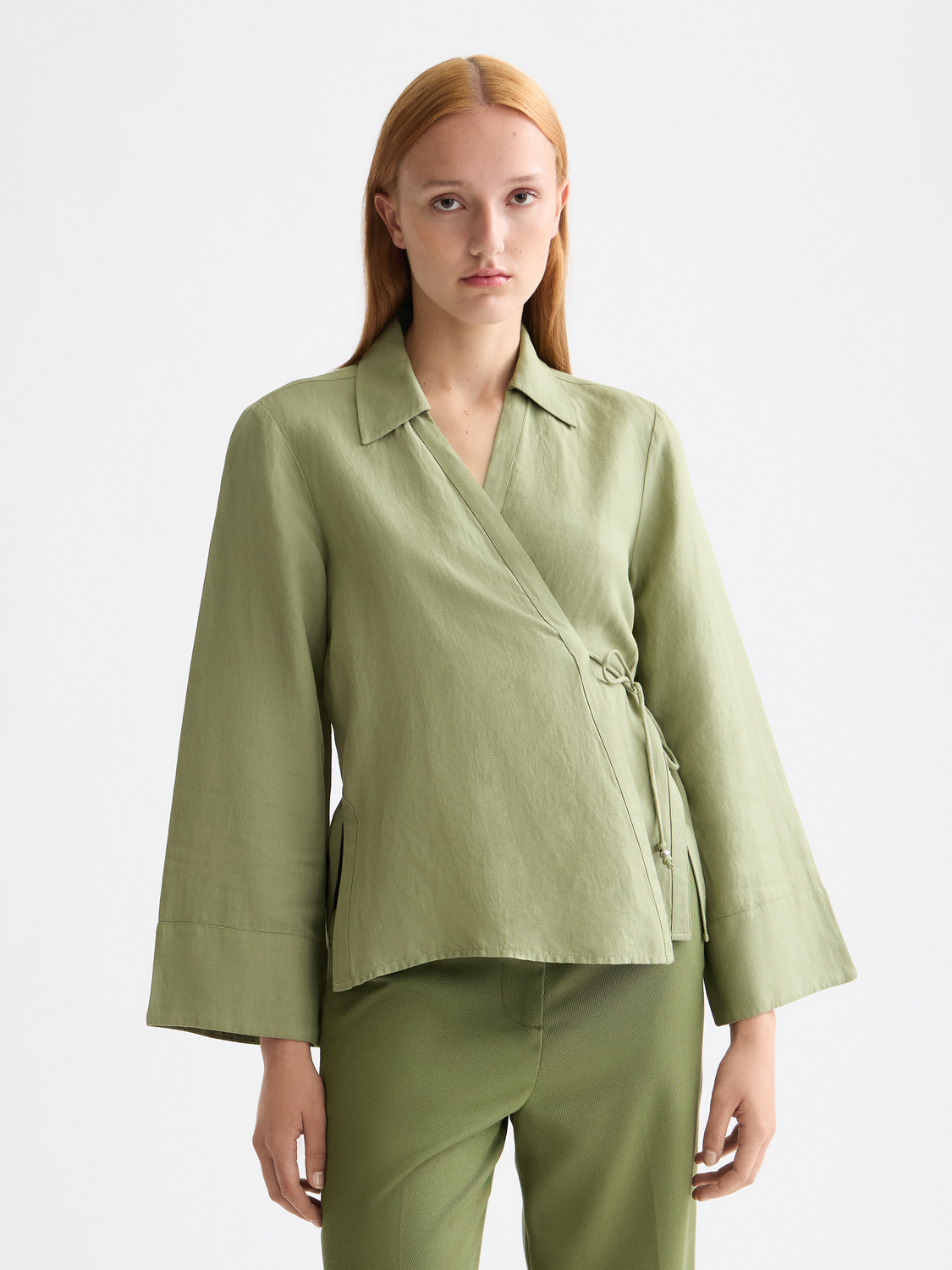 Long-sleeve wrap shirt by Scotch & Soda, featuring a stylish design with a fitted waist and button-front closure.