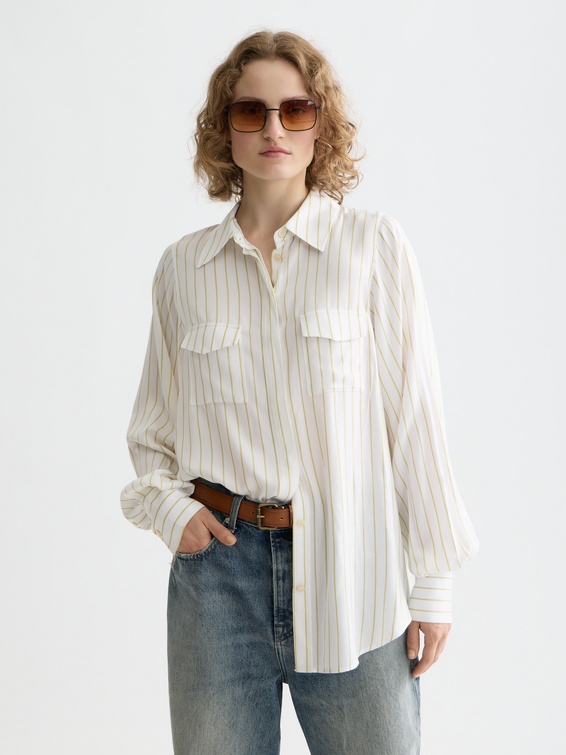 Long sleeve striped pocket shirt by Scotch & Soda featuring a classic design and chest pocket, displayed on a model.