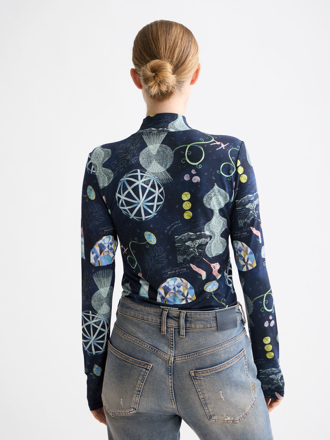 Long sleeve printed mock neck tee by Scotch & Soda, featuring a stylish design and soft fabric in a close-up view.