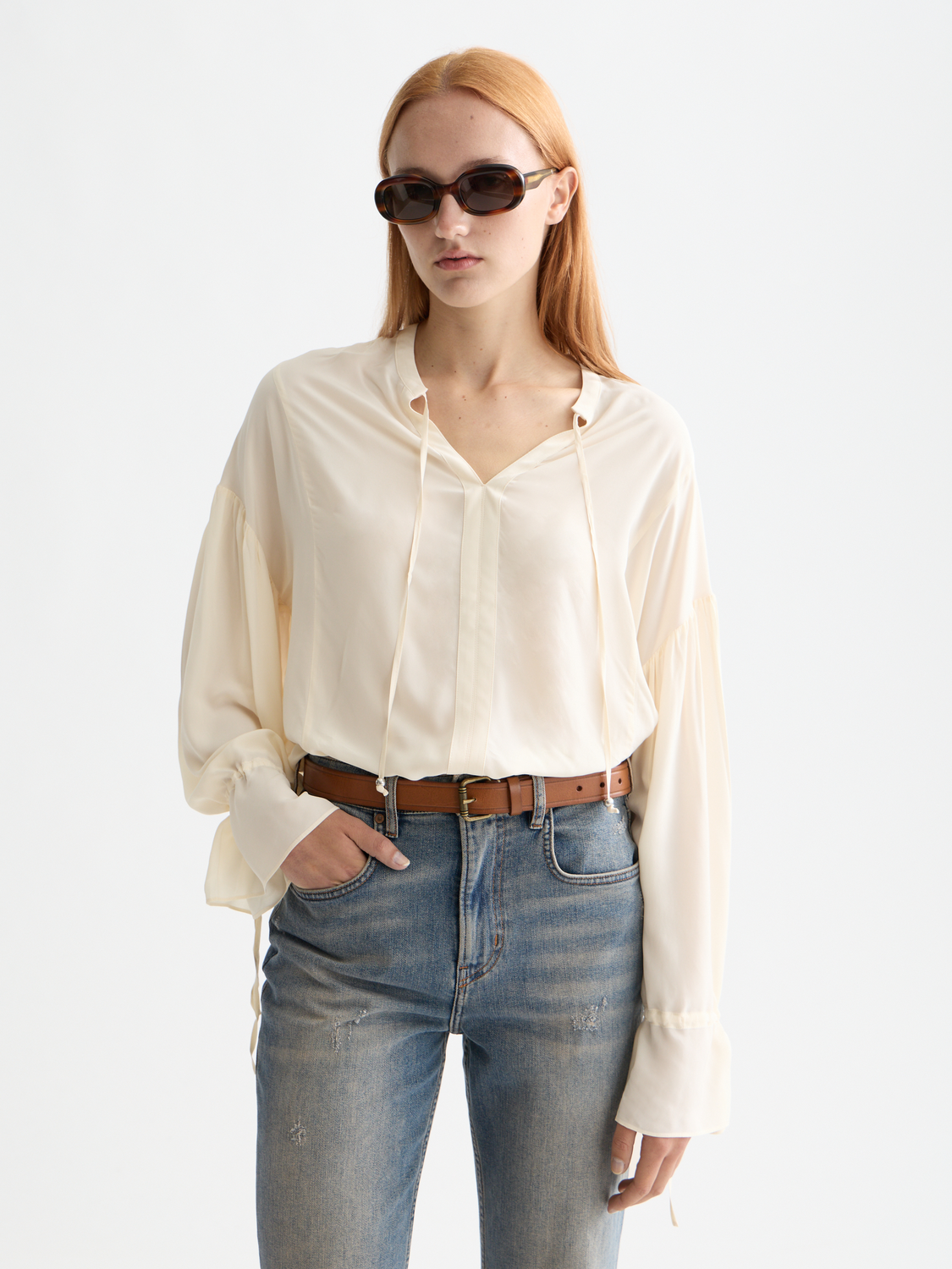Woven Scotch & Soda draw string blouse with relaxed fit and long sleeves, displayed on a mannequin.