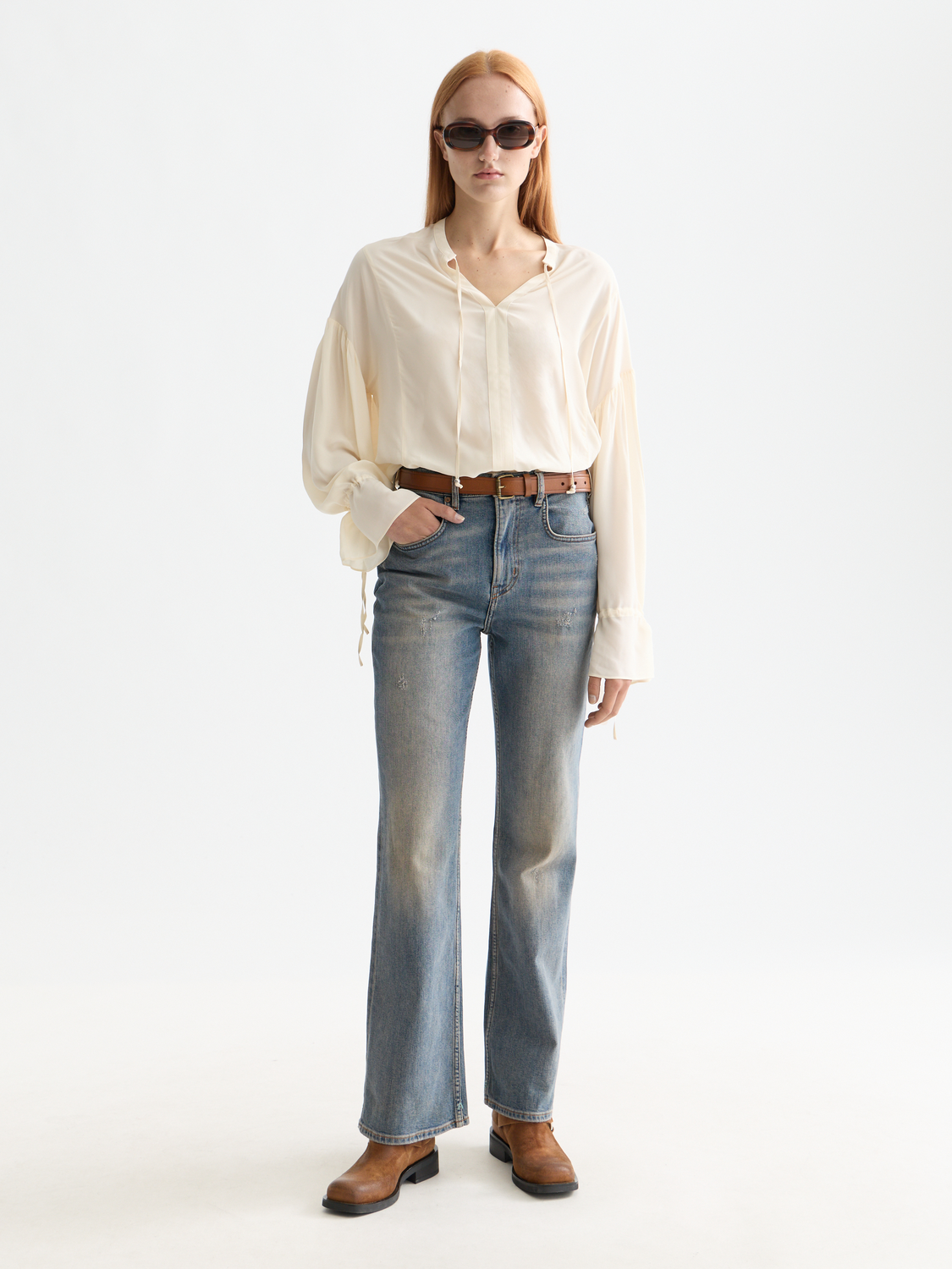 Woven drawstring blouse from Scotch & Soda featuring a relaxed fit, lightweight fabric, and stylish neckline details.