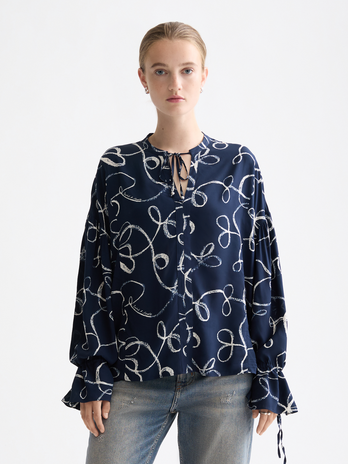 Woven drawstring blouse by Scotch & Soda featuring a relaxed fit, lightweight fabric, and stylish design details.