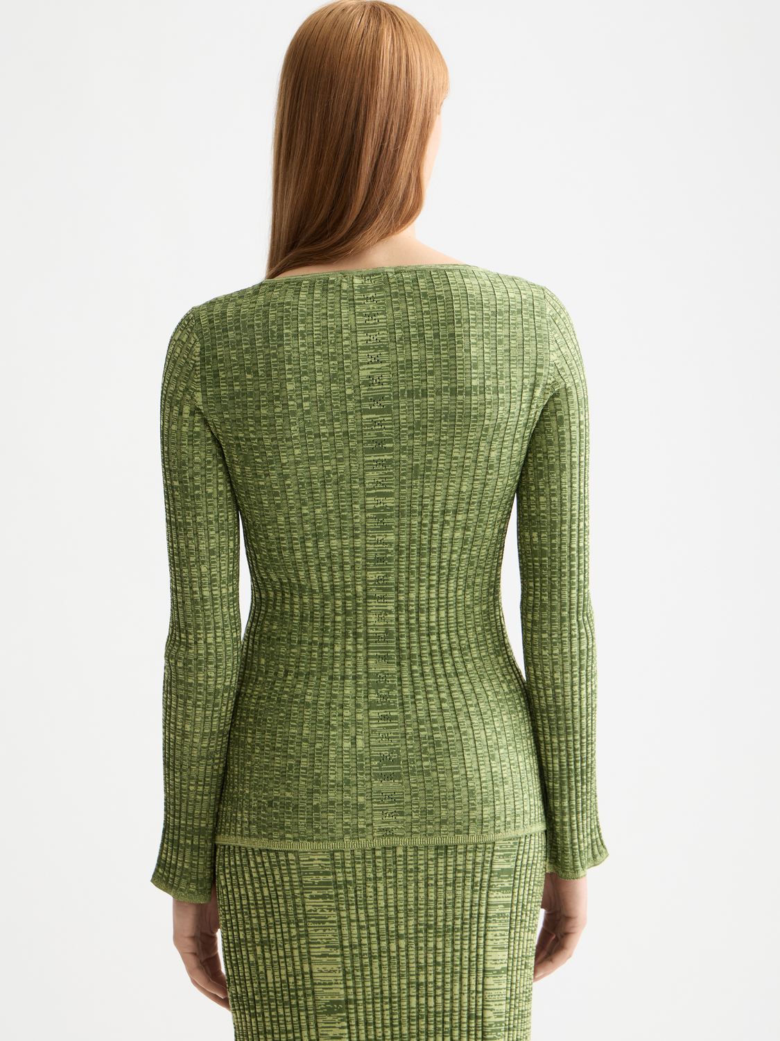 Ribbed knitted pullover in neutral tones, featuring a classic crew neckline and textured knit pattern, from Scotch & Soda knitwear collection.