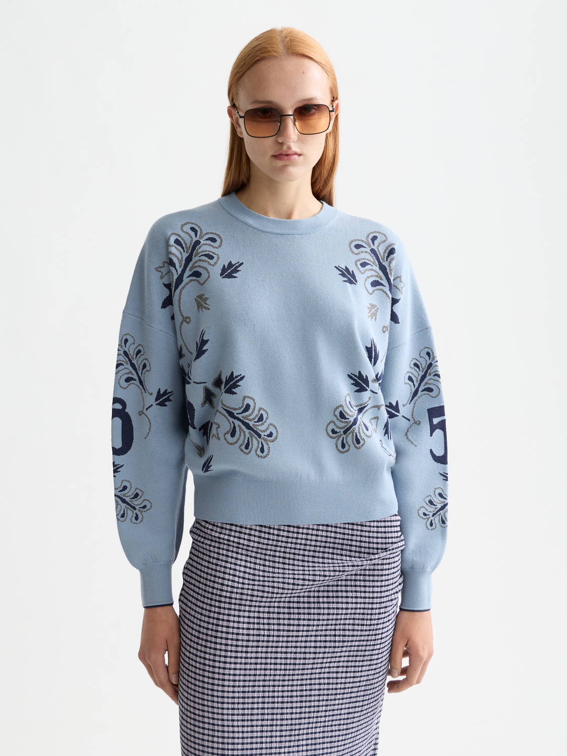 Scotch & Soda jacquard pullover knitwear featuring a detailed woven pattern, displayed on a neutral background.