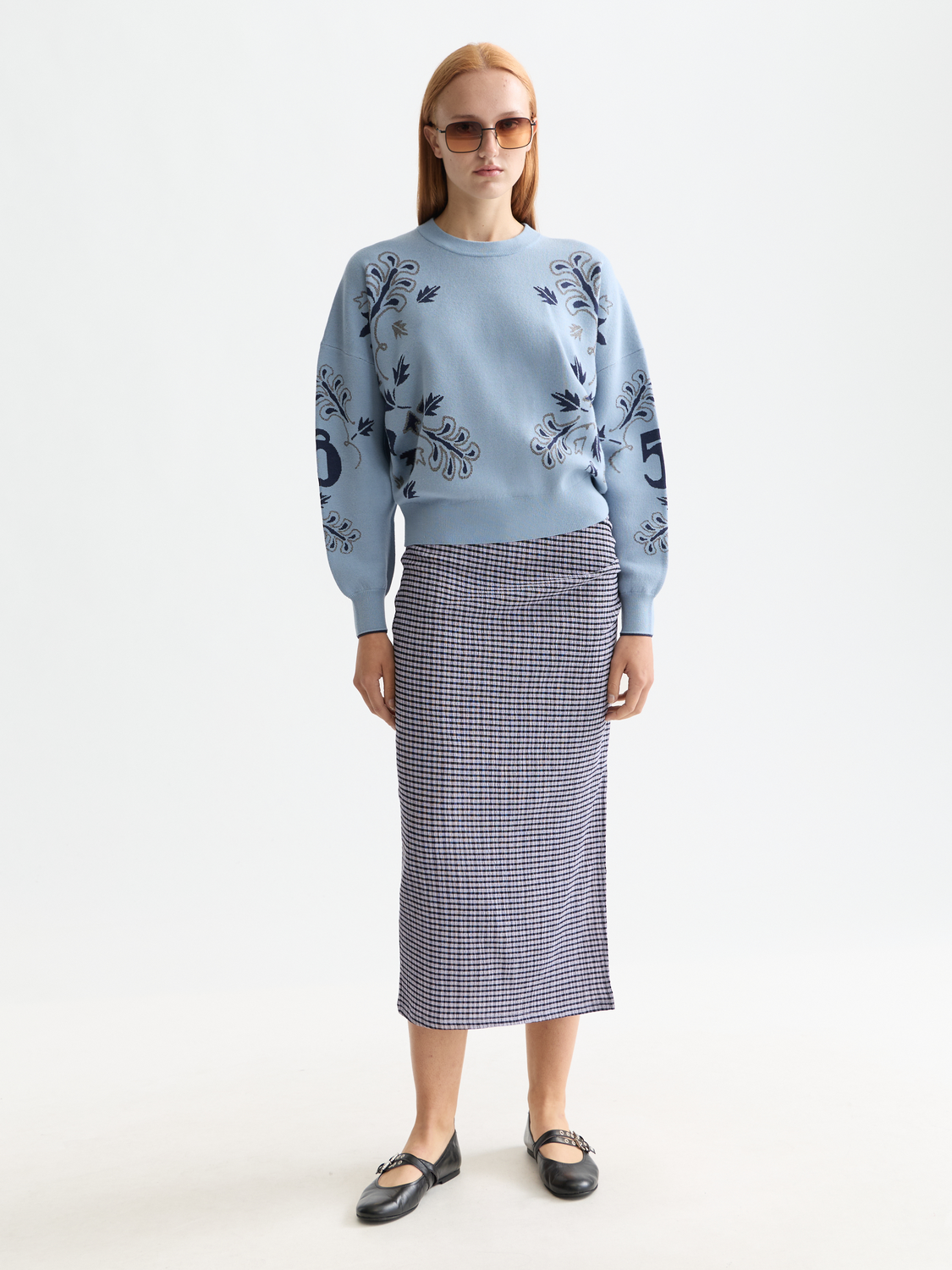 Scotch & Soda jacquard knitwear pullover with intricate patterns, long sleeves, and a classic crew neck design.