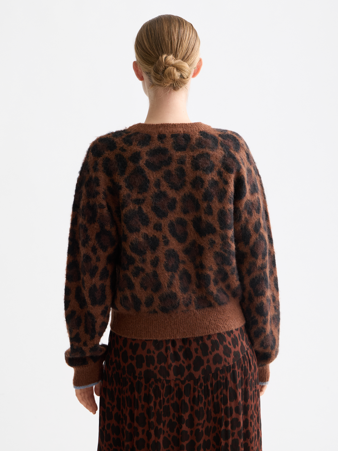 Fuzzy jacquard knitwear pullover by Scotch & Soda featuring a textured pattern and cozy fit, shown from the back.