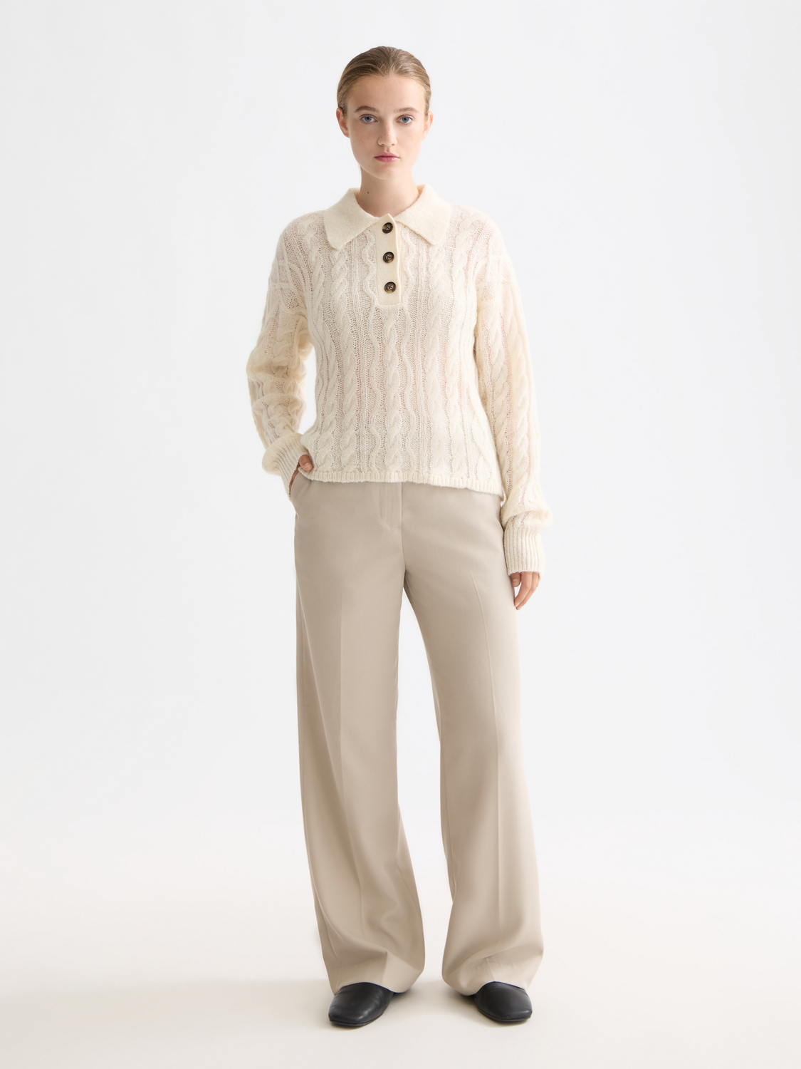 Scotch & Soda cable stitch polo pullover knitwear in navy with textured pattern and ribbed collar, displayed on a mannequin.