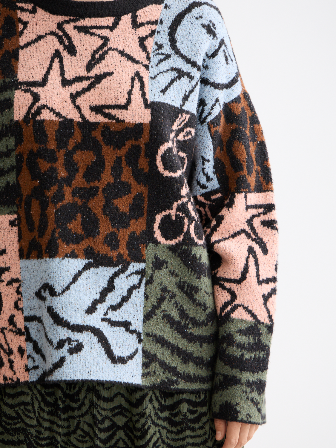 Cream-colored Jacquard oversized knitwear pullover by Scotch & Soda, showing textured pattern and relaxed fit.