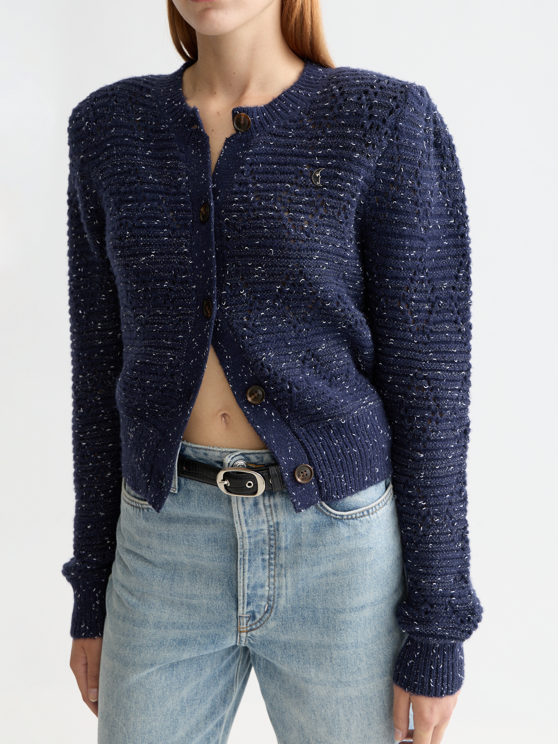 Metallic crewneck cardigan by Scotch & Soda, stylish knitwear with a shiny metallic finish, displayed on a flat surface.