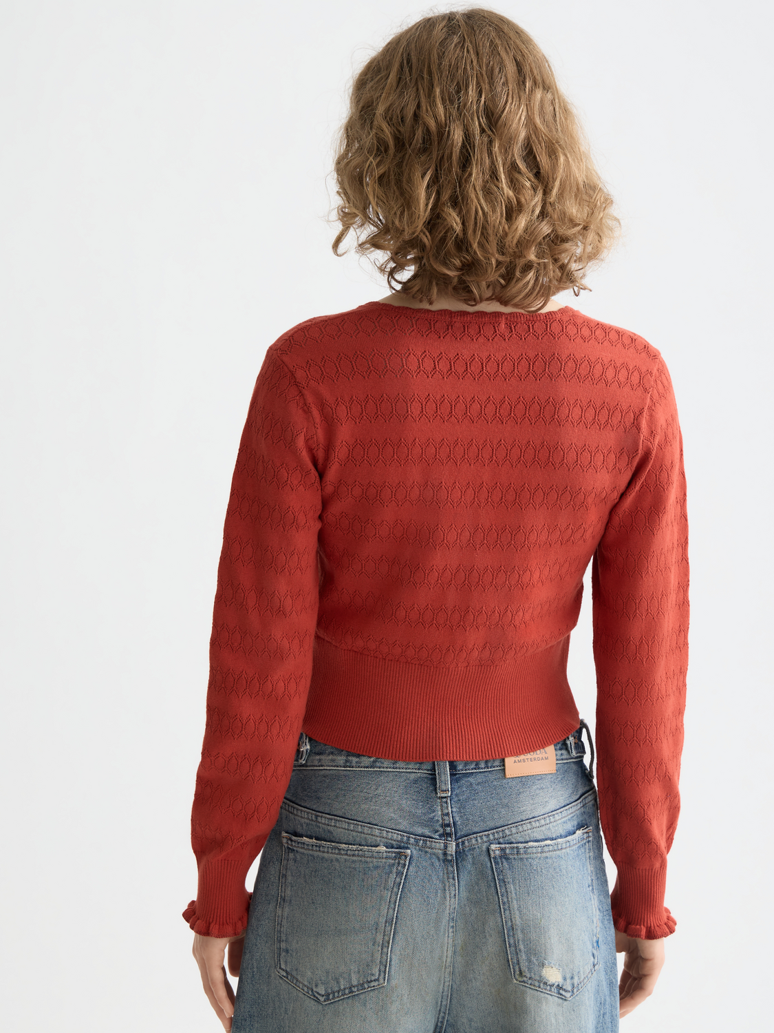 Pointelle knitted cardigan by Scotch & Soda, featuring delicate knit pattern, long sleeves, and a cozy, stylish design.