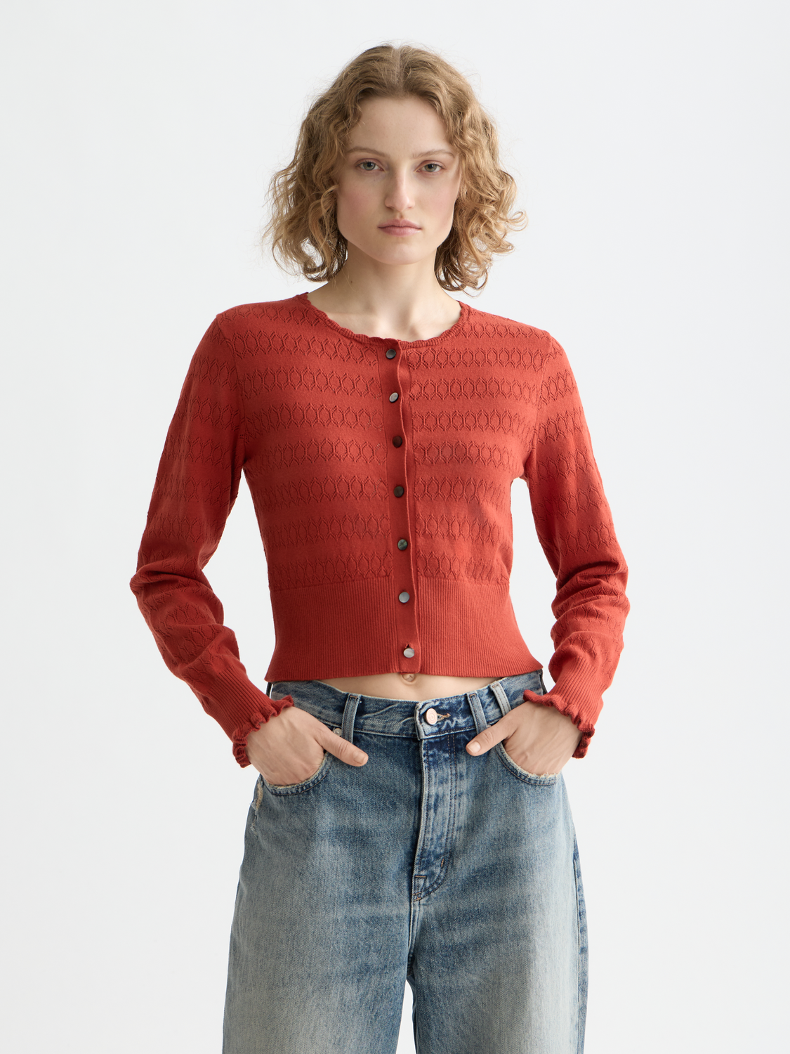 Pointelle knitted cardigan from Scotch & Soda, featuring delicate knit pattern and button-front design.
