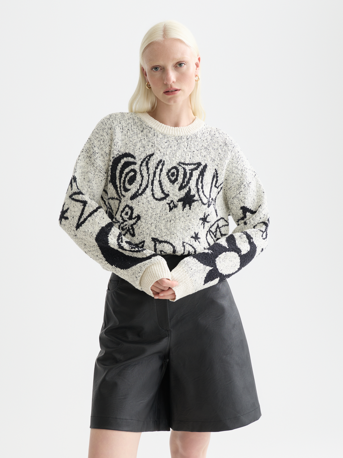 Scotch & Soda jacquard knit pullover featuring intricate patterns in cozy knitwear style.