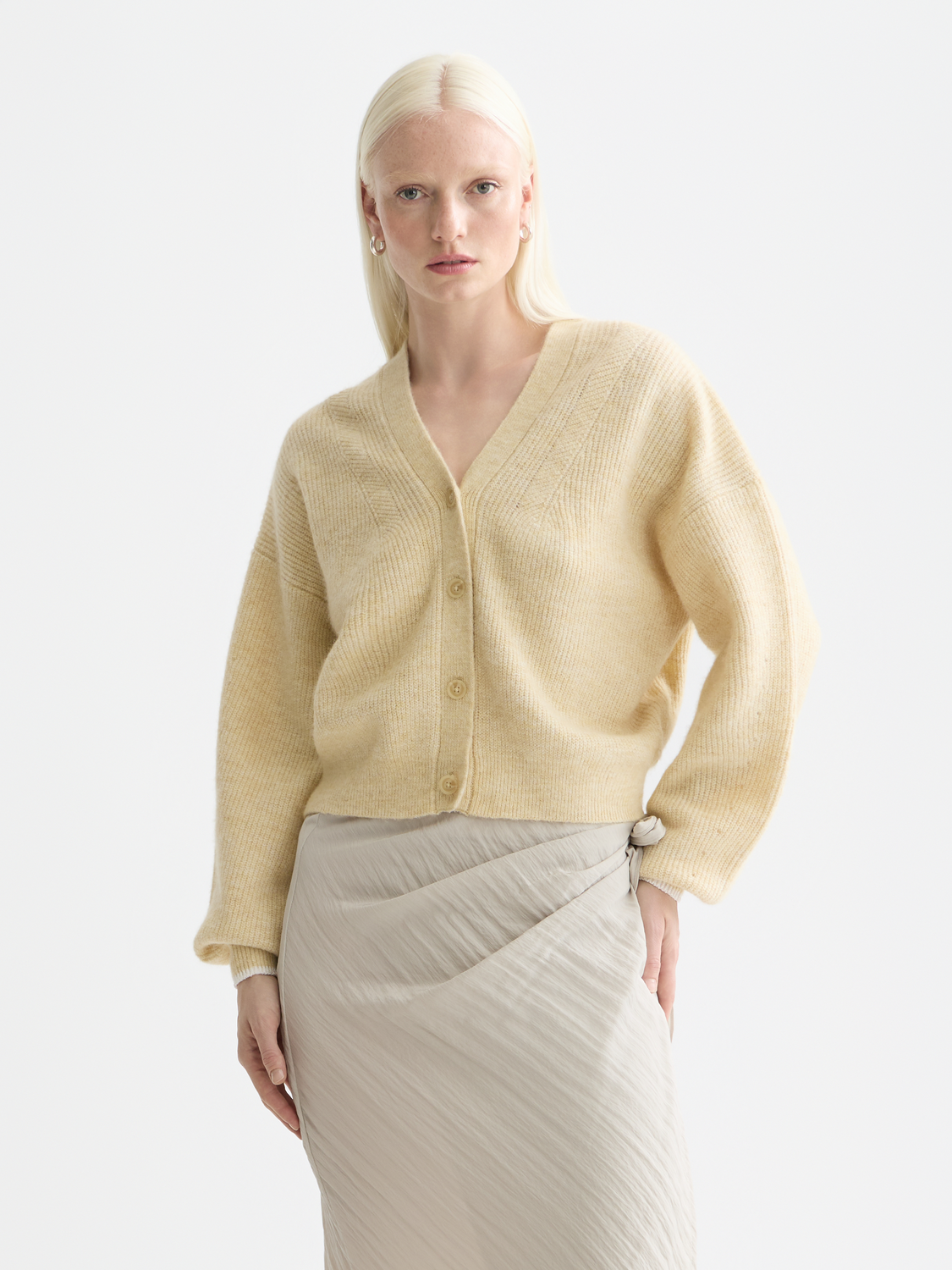 Fuzzy knit cardigan from Scotch & Soda featuring a soft, textured fabric in a cozy style, with front buttons and long sleeves.