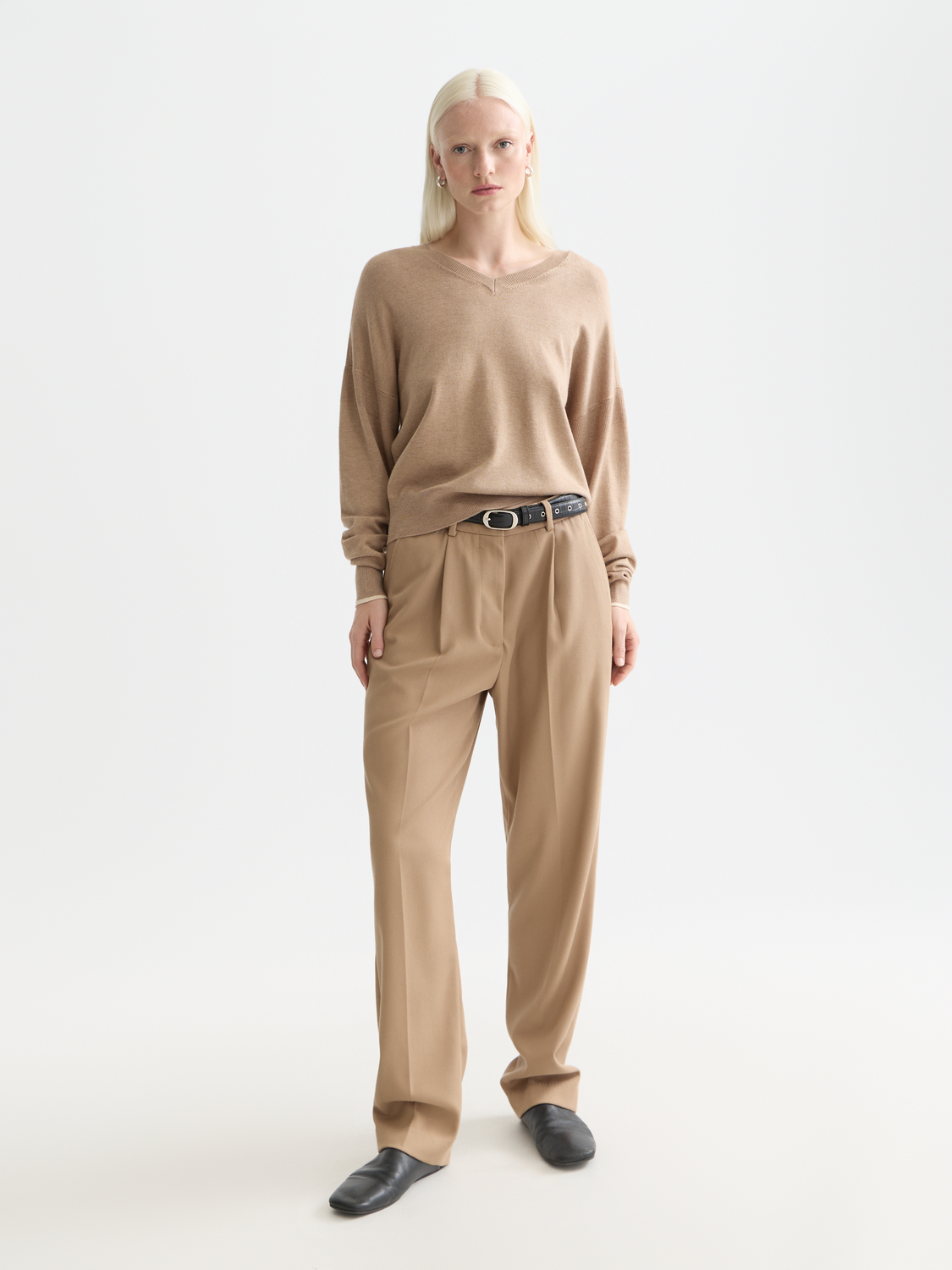 Relaxed-fit V-neck knit pullover by Scotch & Soda, showing soft fabric and casual style on a model.