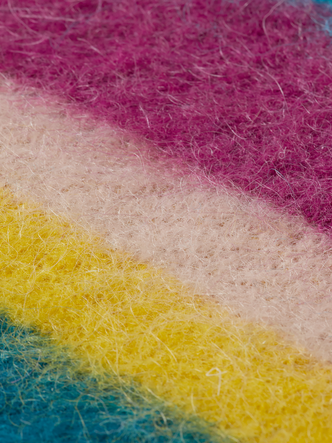 Close-up of a cozy fuzzy knitwear pullover by Scotch & Soda, featuring soft texture and warm, casual style.